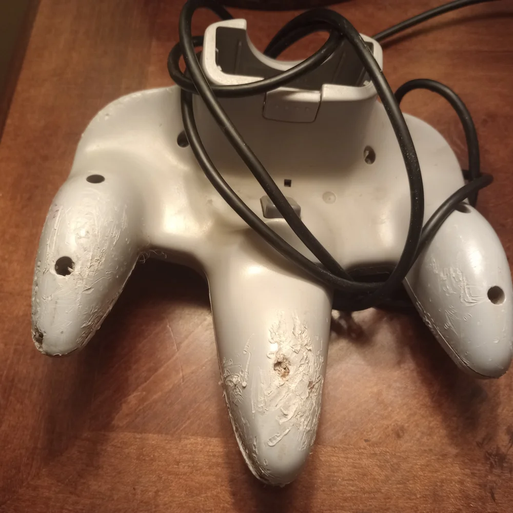 Gray and Pink Video Game Controllers